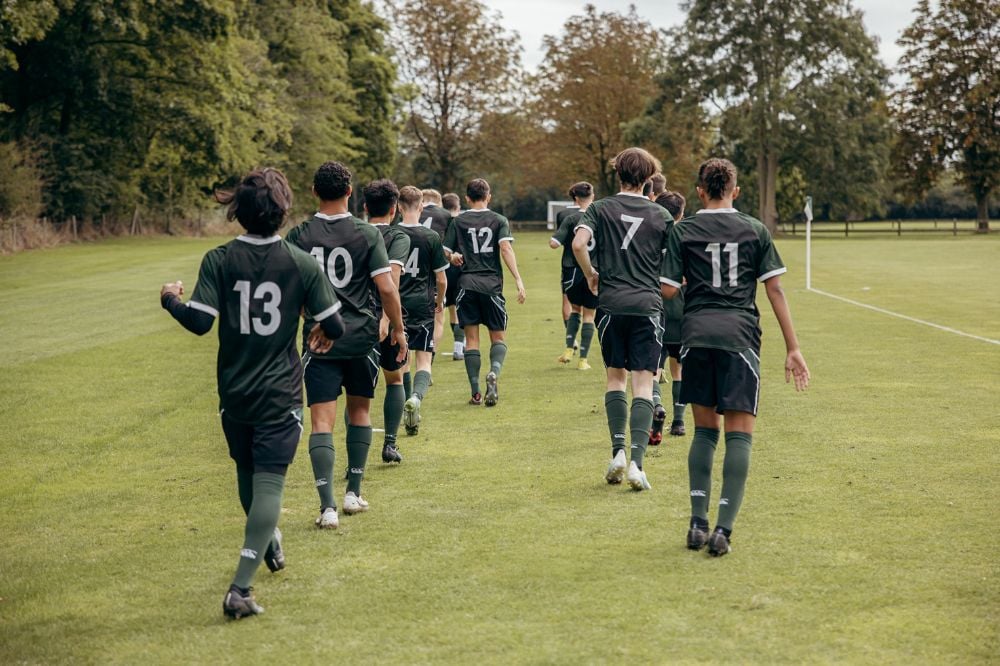 Boarding School Football Team walking out to match