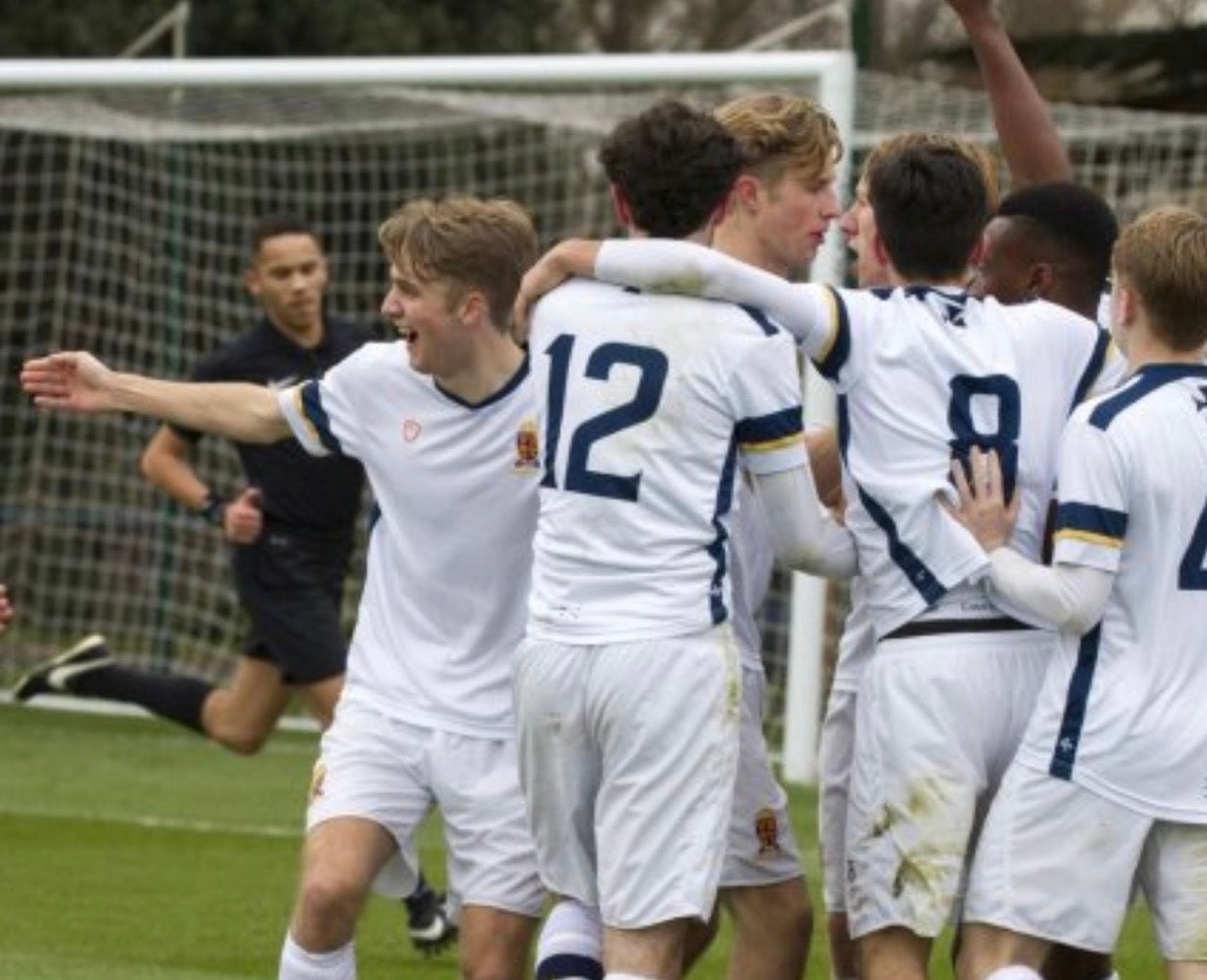 School Football Team Celebrating